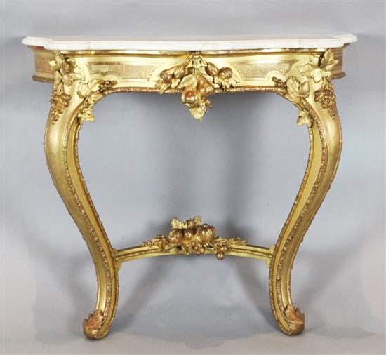 A Victorian giltwood console table, with serpentine veined white marble top, W.3ft D.1ft 4.5in H.2ft 7in.